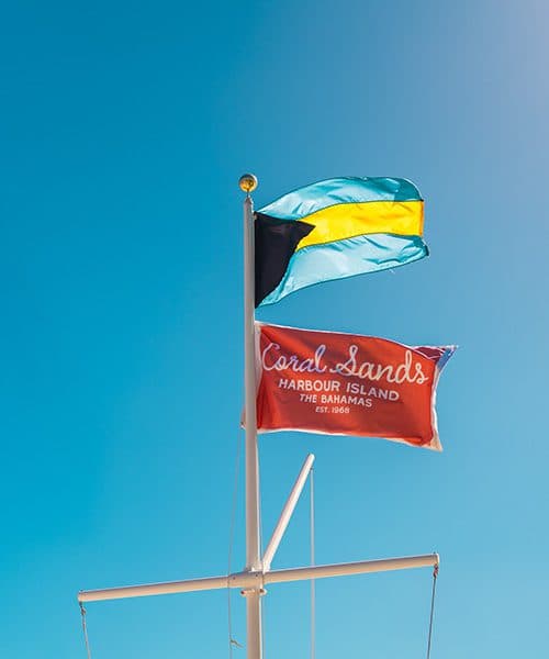 coral sands and Bahamian flag