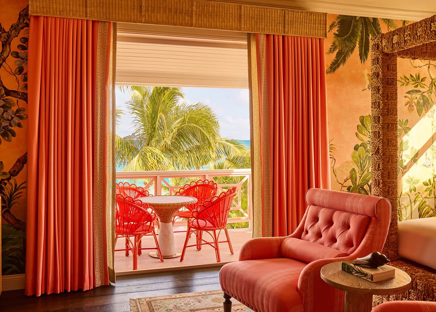 balcony with table and four chairs in sea suite