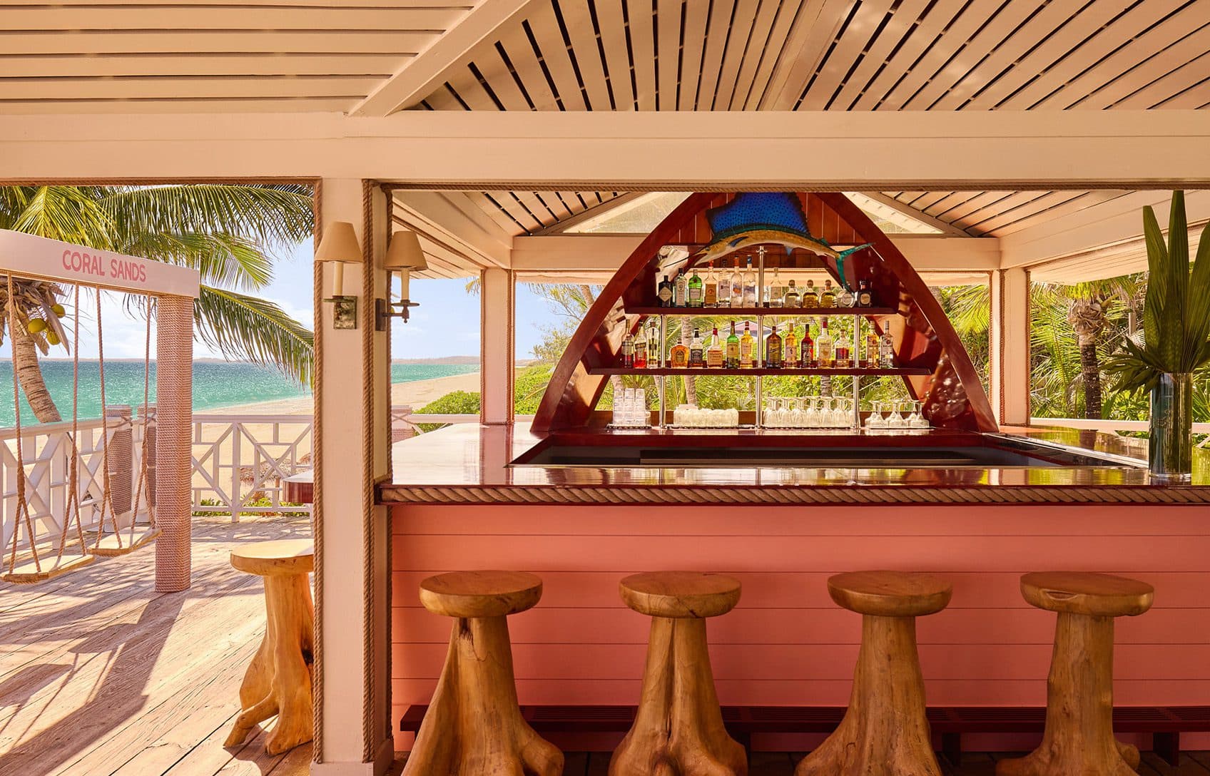 beach bar with swings facing the ocean