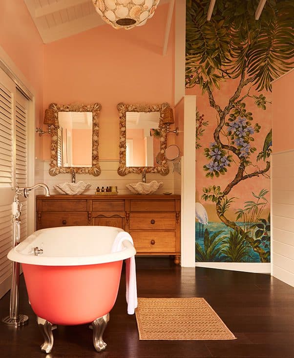 pink clawfoot tub and double vanity